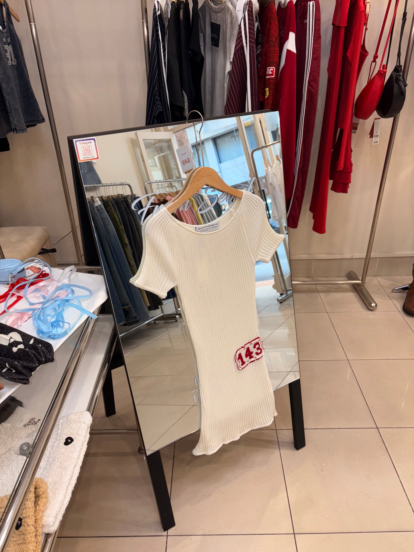 Sculptor pleated knit mini dress