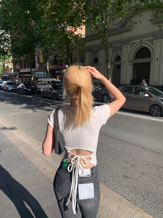 Embo back details top